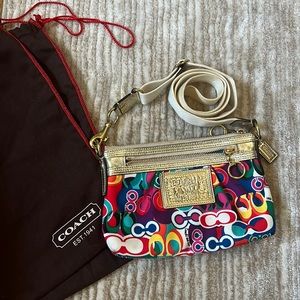 Authentic Coach cross-body bag. In near perfect condition. Includes dust bag.